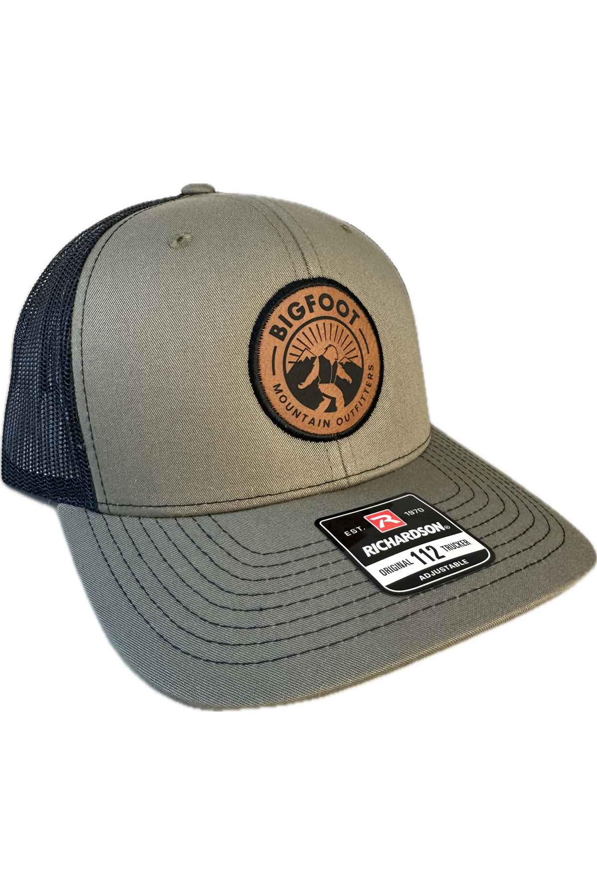 Bigfoot Mountain Outfitters signature mesh hat in Loden/Black, a classic trucker hat for fishing, hiking, road trips, game days and everyday wear