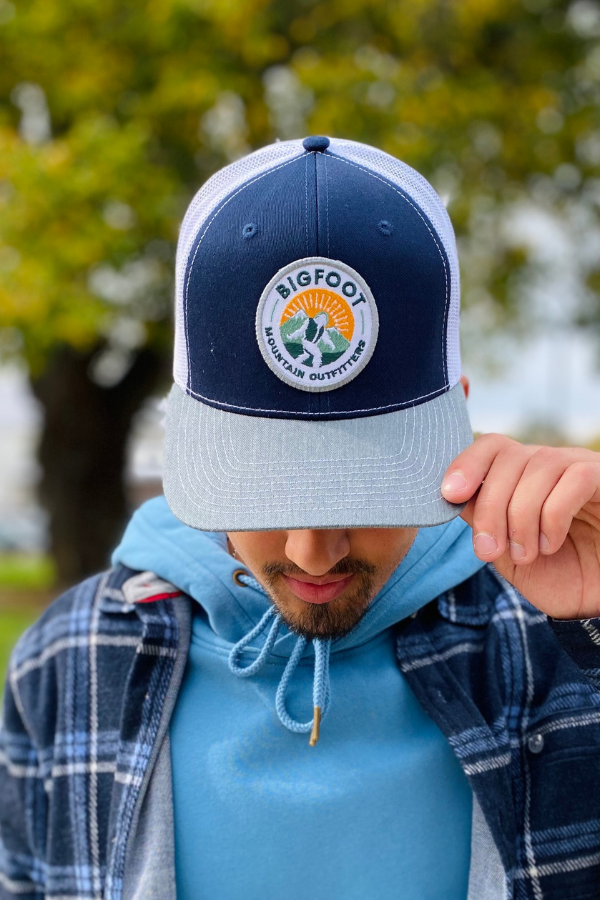 Bigfoot Mountain Outfitters original patch logo mesh back hat in Navy/Charcoal/White, a casual classic trucker hat for sunny days on the water, road trips, festivals and everyday wear