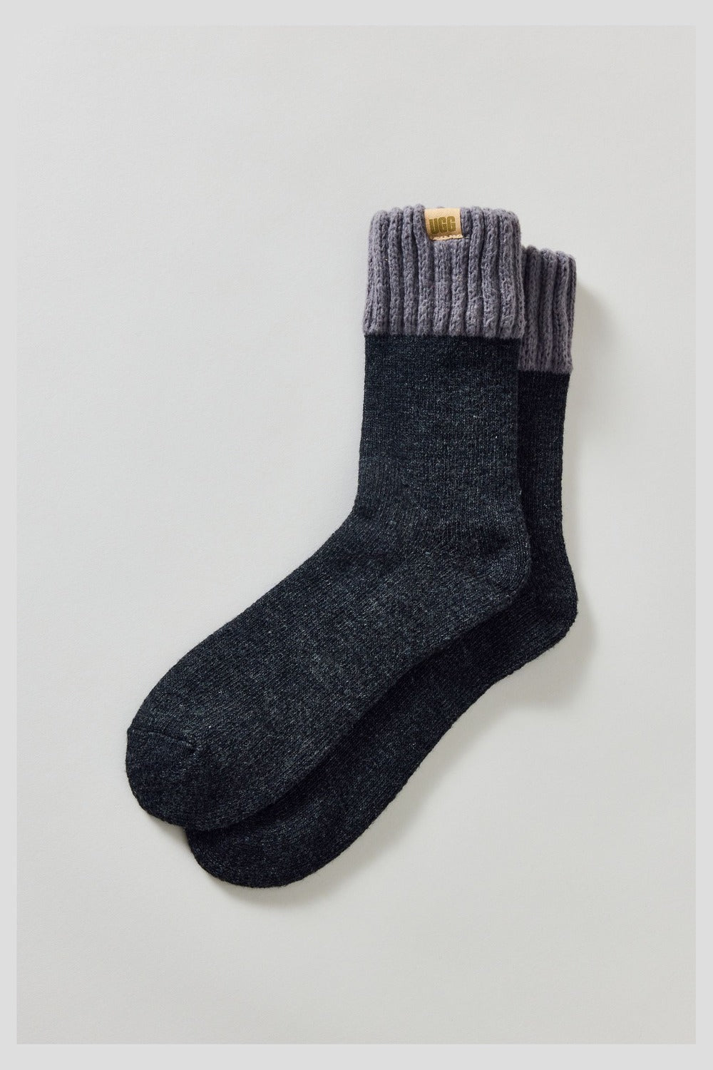 UGG men's Camdyn Cozy Sock in tar and charcoal, a warm crew sock with a contrast cuff for wearing with boots, slippers and lounging
