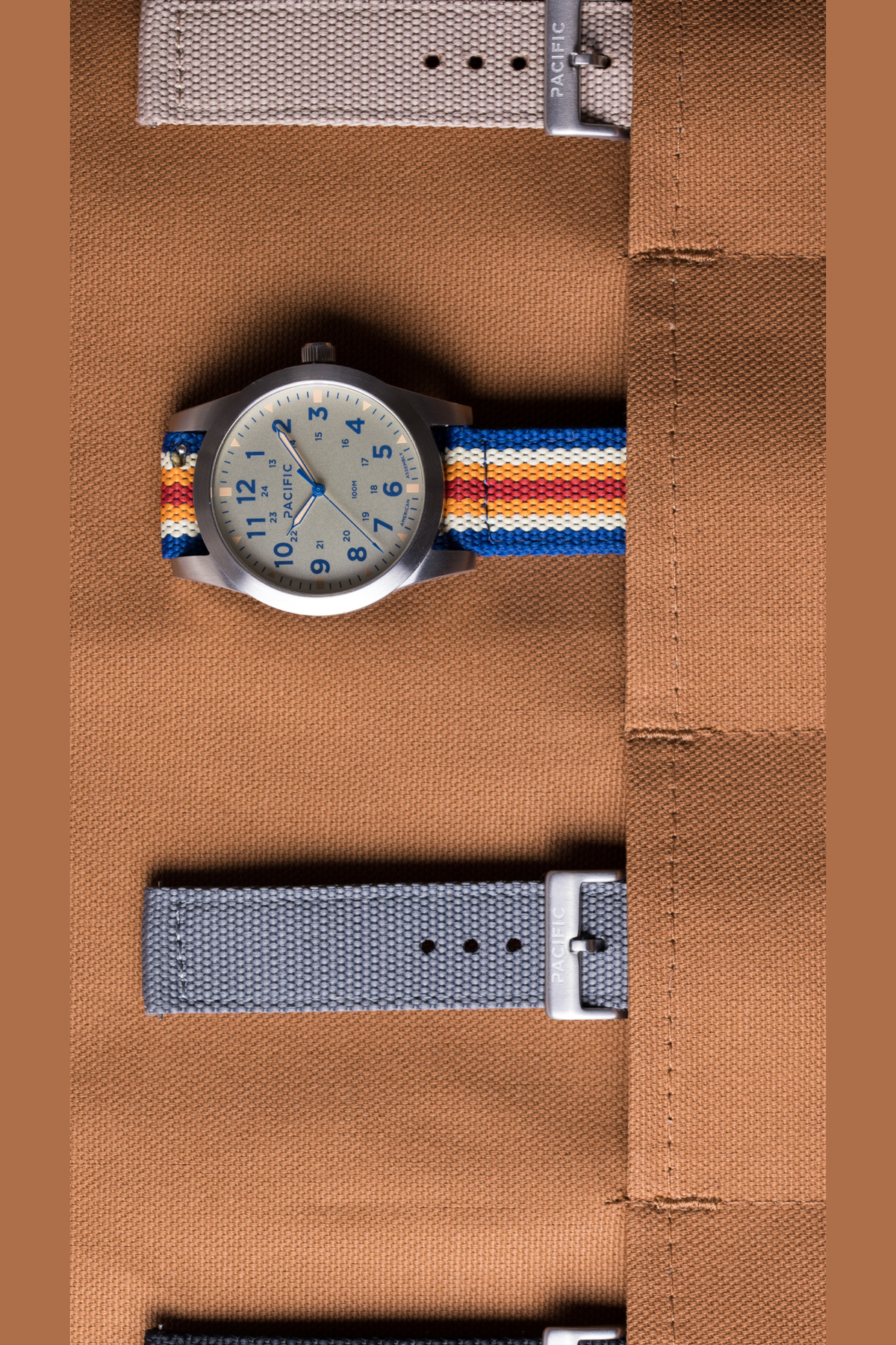 Pacific Watch Company Cascadia field watch in Slate Blue with PWC Stripe strap, a rugged USA-assembled 316L stainless steel watch for hiking, fishing, travel and everyday wear, a great gift for him