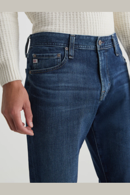 AG Graduate tailored-leg jean in Midlands, a comfortable, polished denim staple that dresses up for the office and dinner or down for weekends