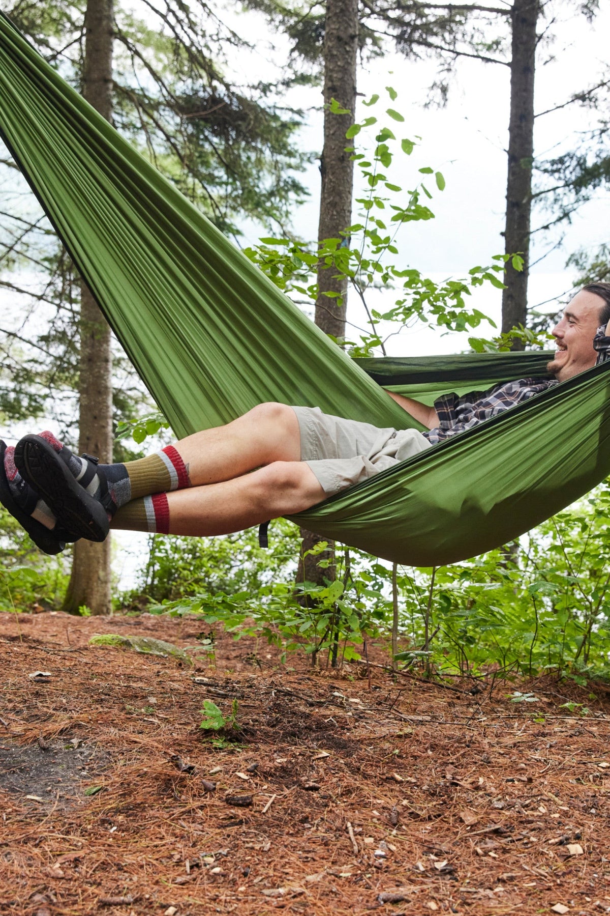 Darn Tough Heady Stripe Micro Crew Lightweight Hiking Socks in Ash worn outdoors, a lightweight cushioned merino hiking sock with retro stripes for day hikes, trail runs and everyday wear with boots or sneakers, guaranteed for life