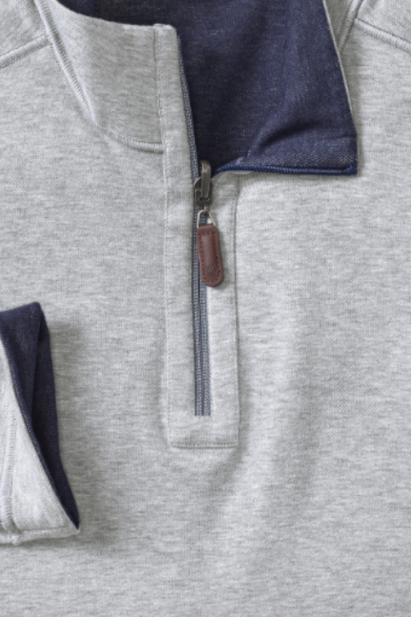 Johnston & Murphy Icon reversible quarter zip in Navy/Storm, a two-in-one pullover you can flip for a new look at the office, on the golf course or while traveling