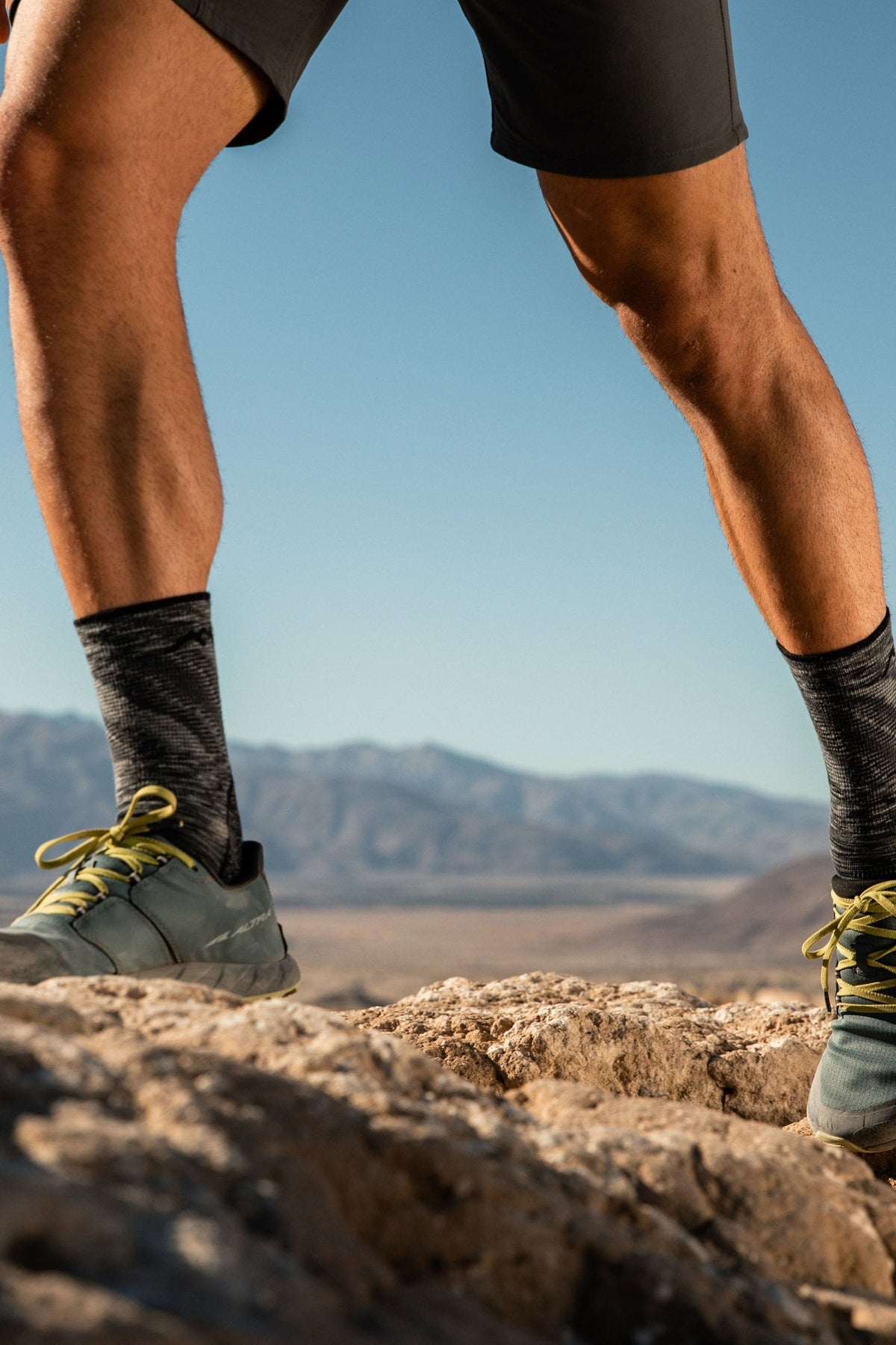 Darn Tough Men's Light Hiker Micro Crew Lightweight Hiking Socks in Space Grey worn outdoors, a lightweight cushioned merino hiking sock that keeps feet dry and comfortable on day hikes, backpacking trips and everyday outdoor wear, guaranteed for life