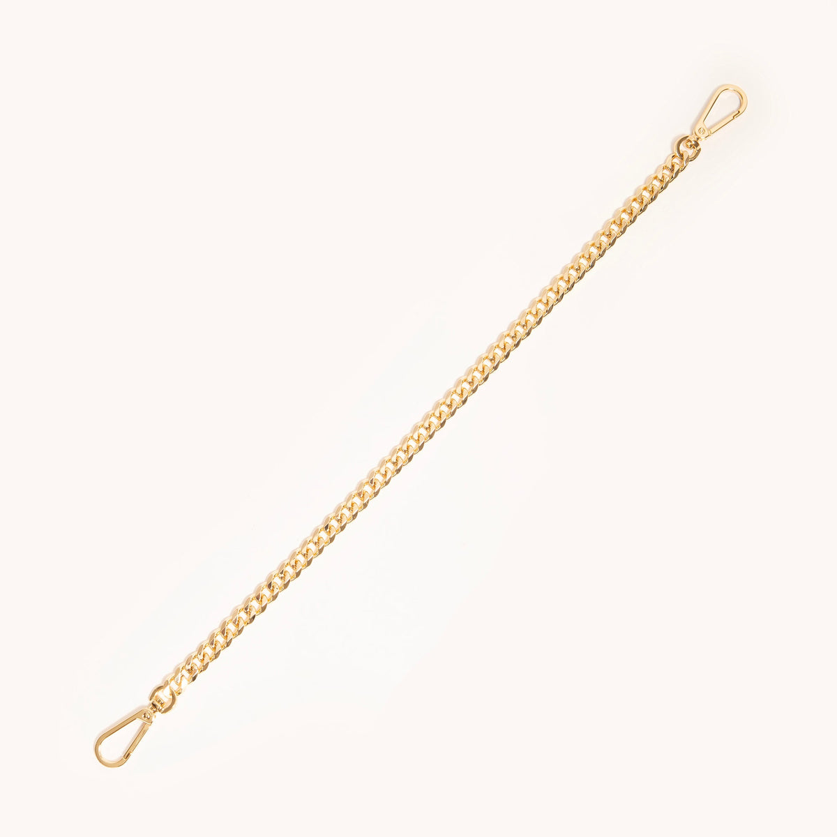 Hammitt Metal Chain Shoulder Strap in Gold shown full length, a polished curb chain with clip hardware for Hammitt handbags