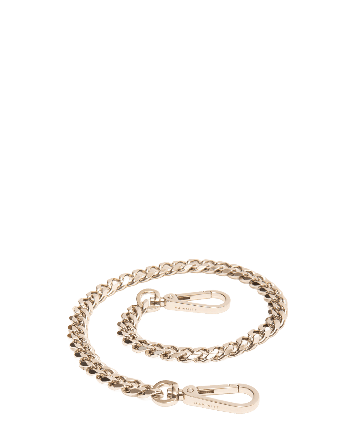 Hammitt Metal Chain Shoulder Strap in Silver coiled, showing the curb links and clip hardware that attach to Hammitt bags