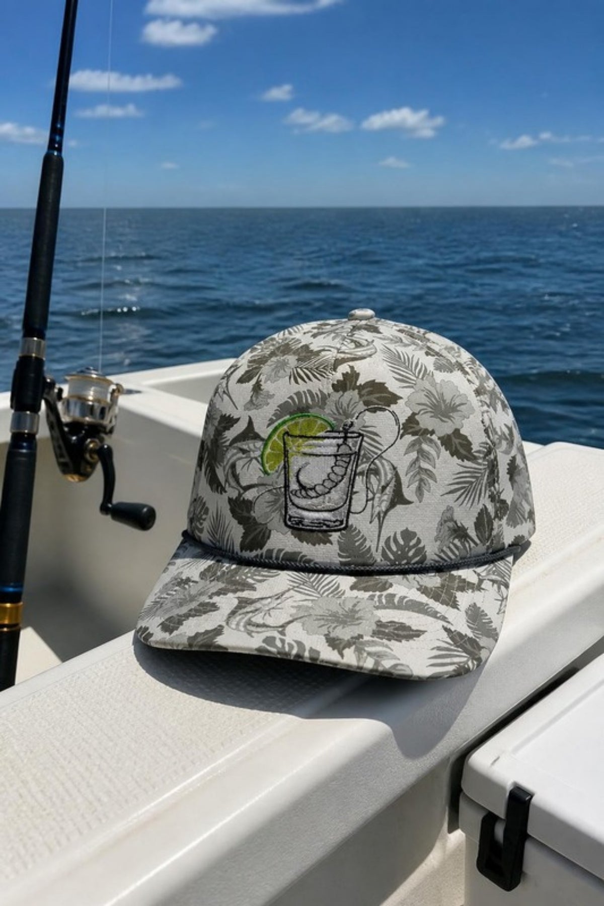 Paramount Outdoors Mezcal Saltwater Fishing Hat in Grey on a fishing boat, a lightweight tropical-print rope hat for saltwater fishing, boat days, vacations and summer happy hours