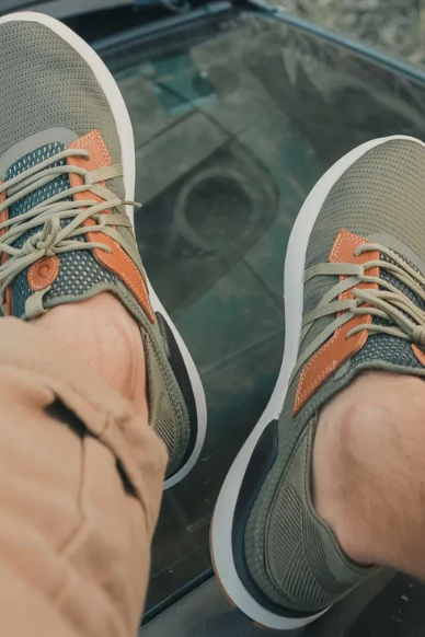 Olukai Mio Lī Sneaker - Hunter/Lava Rock, a comfortable, versatile shoe for the office, travel days, dinners out and weekends