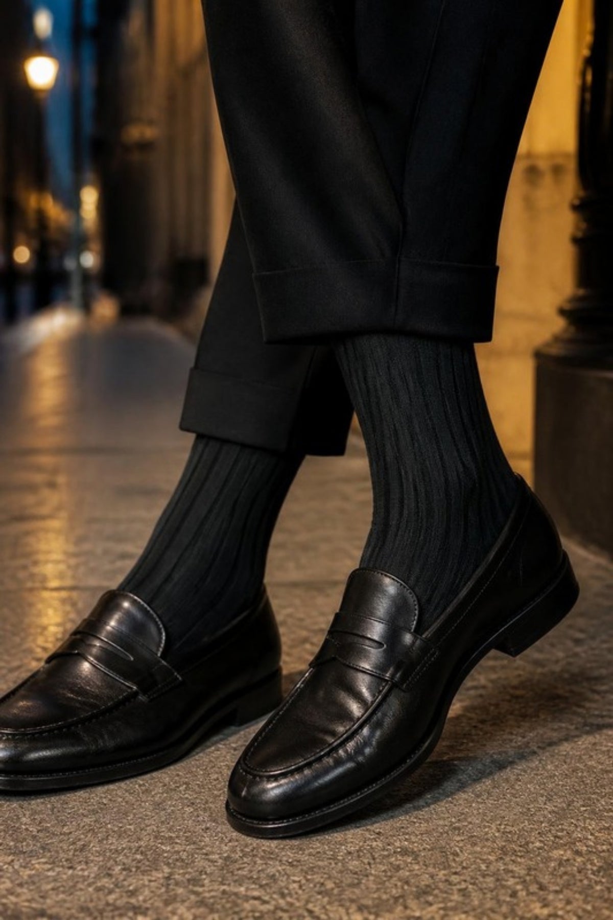 Johnston & Murphy Pima Cotton Ribbed Socks in Black worn with black trousers and loafers on a city evening, soft breathable dress socks for suits, date nights, weddings and formal events