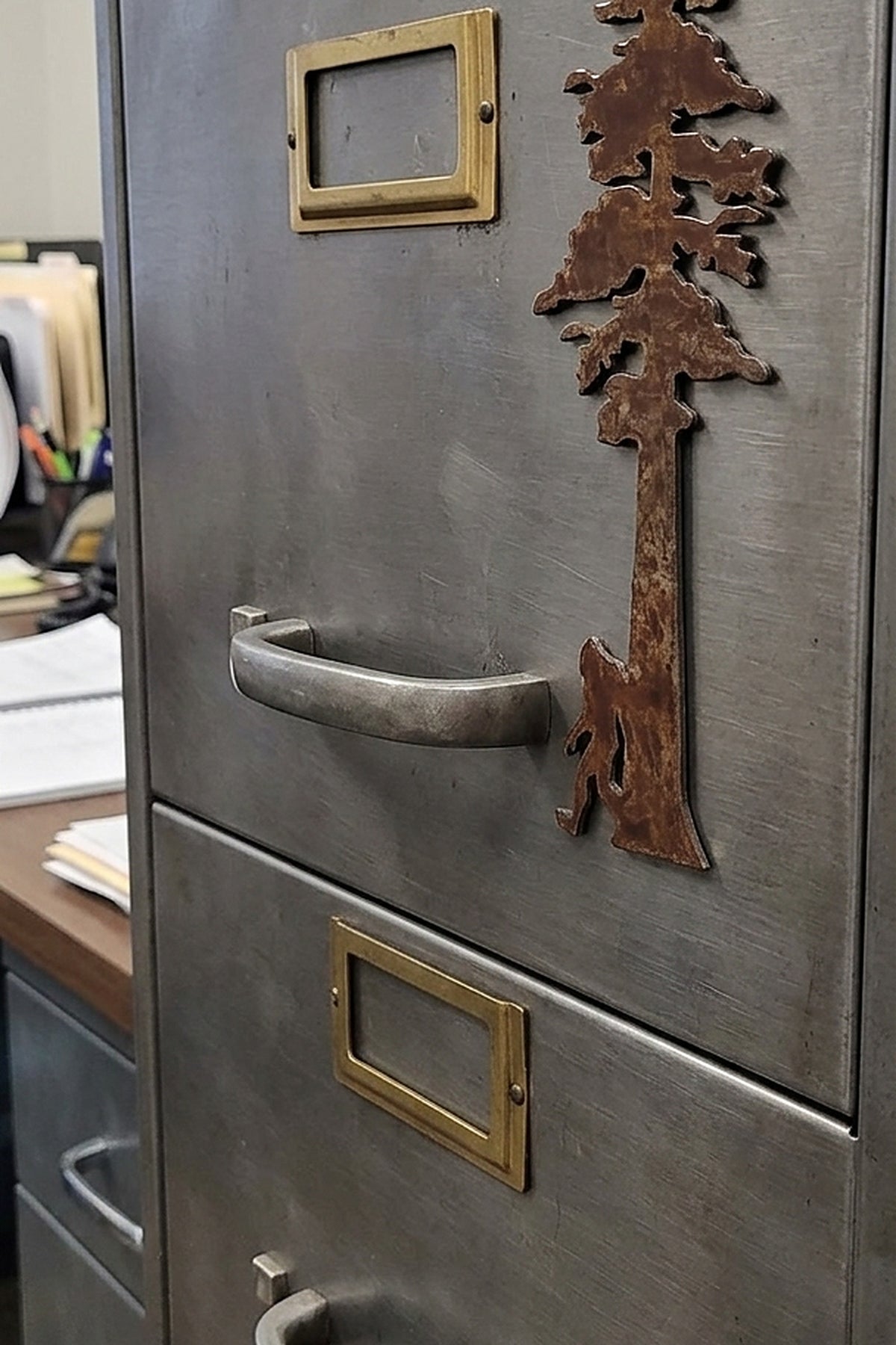 Paradise Cay Publications Redwood Tree with Bigfoot magnet on a steel file cabinet, a tall rusted steel redwood and Bigfoot magnet for the office, garage or fridge, and a great Pacific Northwest gift