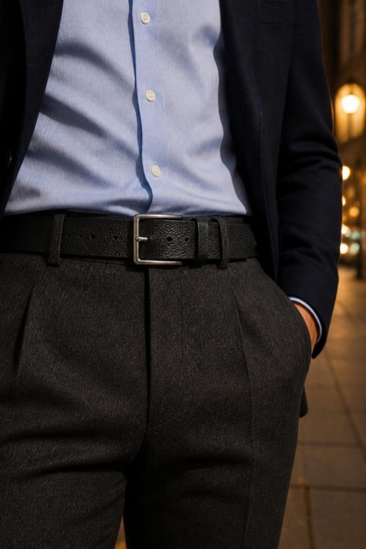 Johnston & Murphy Soft Pebble Belt in Black worn with charcoal trousers and a blazer, a soft pebbled leather belt that finishes work outfits, weddings, date nights and dressier events