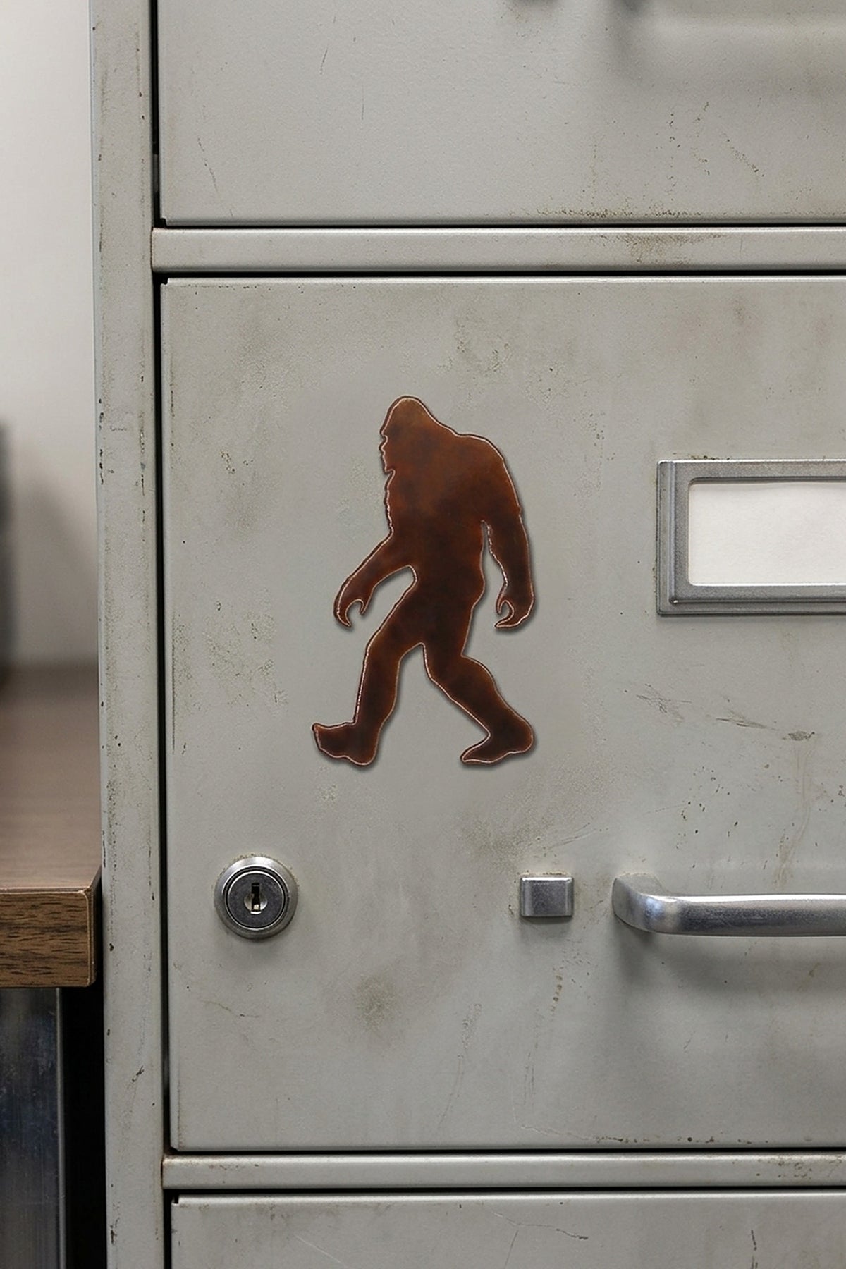 Paradise Cay Publications Walking Bigfoot small magnet on a file cabinet, a fun Bigfoot magnet for the office, garage or kitchen