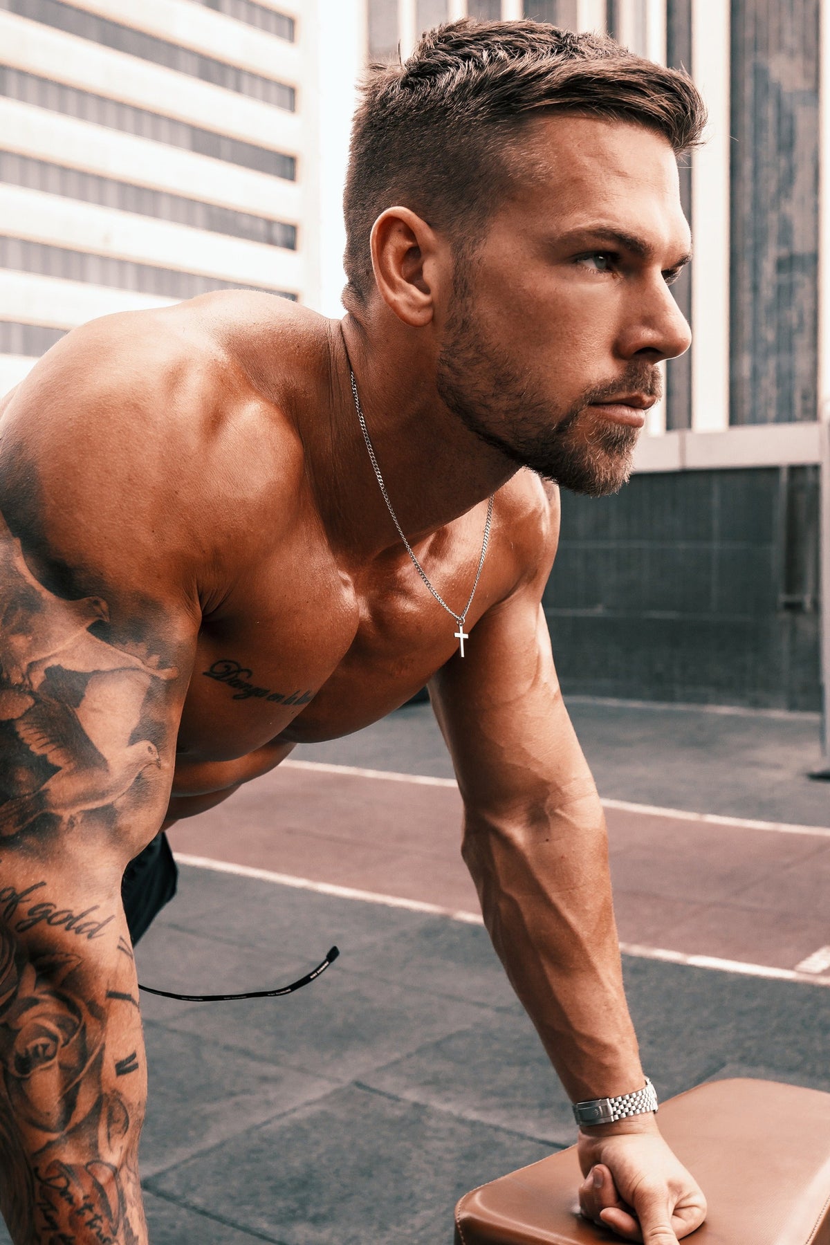 We Are All Smith Waterproof Stainless Steel Cross for Men worn during a workout, a sweatproof stainless cross necklace that won't tarnish at the gym or on the job